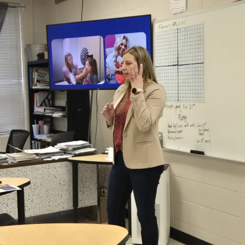 Co Owner Carmen, SLP speaking with students at Chilhowee Career Day